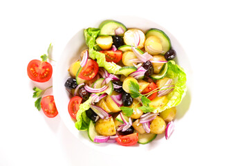mixed vegetable salad with potato, tomato, olive and onion