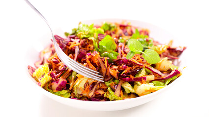Salad coleslaw - red cabbage with carrots on white dish