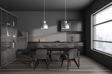 Gray kitchen with cabinets and table
