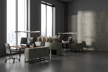 Modern office interior with pc computer on work desk, panoramic window