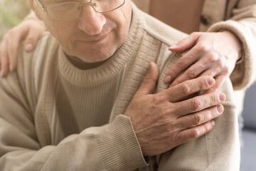 Two people holding hand together. elderly man and support woman