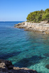 Vertical Landscape of Turquoise Adriatic Sea with Rocky Cliff in Pula. Summer Scenery with Blue Water in Croatia.