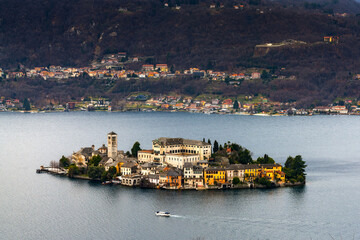 view of Lake Orta and the Isola San Guilio islet with its historic buildings