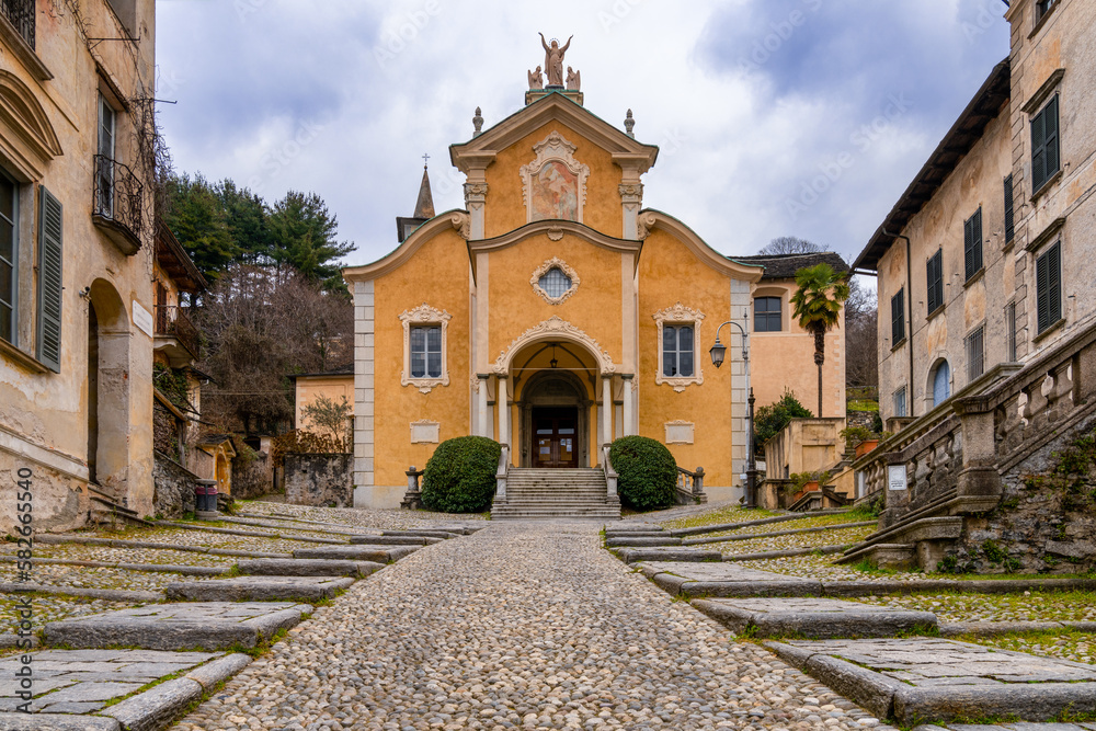 Poster steep cobblestone street leading to the historic penotti ubertini palace in orta san giulio