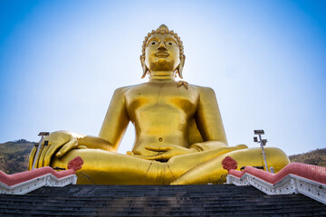 Big Buddha statue in gold color at Khao Wong Phra Chan Temple.Lopburi, Thailand