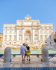 Men and women tourists at the Trevi Fountain, Rome, Italy. City trip Rome couple on a city trip in...