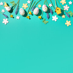 Easter square frame with flower design eggs, hyacinths, flower decor on spring green background