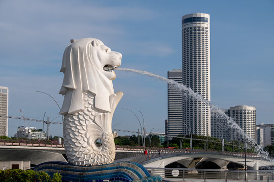 Singapore - 22 October 2022: Merlion Statue at Merlion Park, it is a mythical creature with a lion's head and the body of a fish. It is used as a mascot and national personification of Singapore