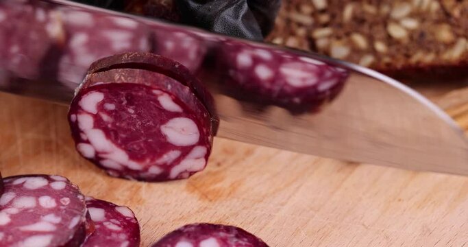sliced high-quality pork sausage with the addition of lard pieces, ready-made food products with the use of pork meat