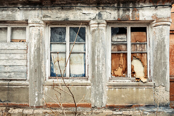 old abandoned house walls with broken windows