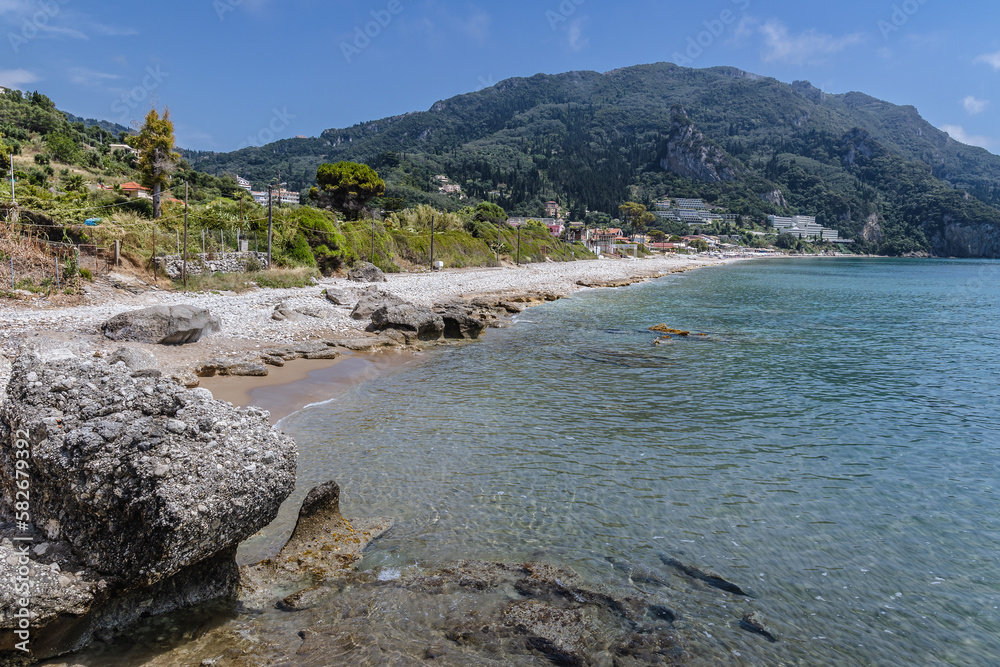 Poster View on the Ionian Sea beach in Agios Gordios town, Corfu Island, Greece