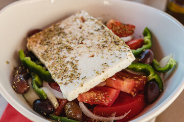 Bowl of traditional Greek salad in restaurant on Corfu Island in Greece