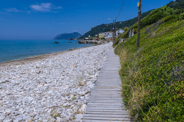 Obraz premium Beach in Agios Gordios village on the Ionian Sea coast, Corfu Island, Greece