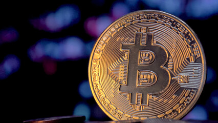 Bitcoin money on a blurry digital background