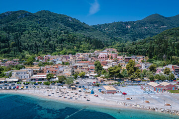 Beach in Benitses village on the Ionian Sea shore, Corfu Island, Greece