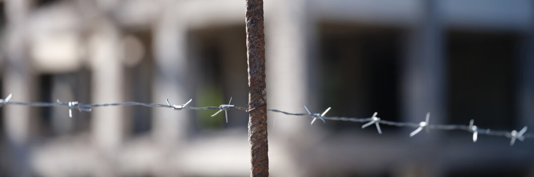 Security barbedwire fence, wire with clusters of short, sharp spikes