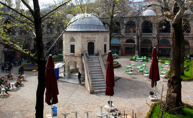 Courtyard view of the two-story Koza Han market with shops and a mosque in the center in Bursa, Turkey © Kateryna M