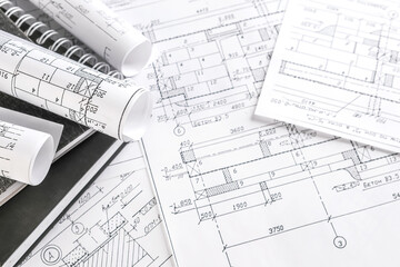 Architects concept, engineer architect designer freelance work on start-up project drawing, construction plan architect design working drawing sketch plans blueprints and making construction model