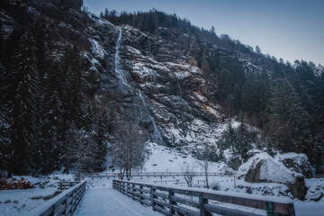 Winter view on Nardis waterfall in Val di Genova, Adamello-Brenta Natural Park in the northern Italy. January 2023