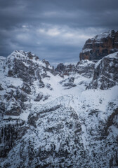 Fototapeta na wymiar Famous Italian Alps Brenta Dolomites, snow on the slopes of the Alps Madonna di Campiglio, Pinzolo, Italy. Ski resorts in Italy. January 2023