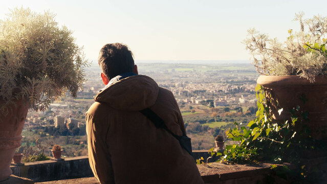 Person Looking At The Horizon In A Small Town In Italy