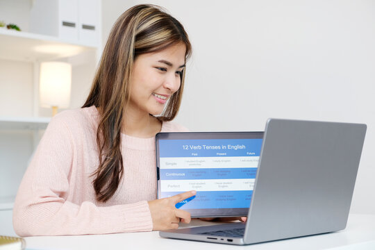 Woman study english language online by laptop computer, learning online course