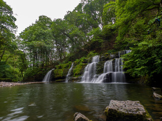 Small waterfalls in forest (Wales, United Kingdom)