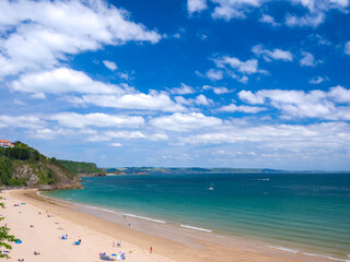 White sandy beach on a sunny day (Tenby, Wales, United Kingdom, in summer)