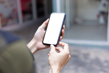 cell phone blank white screen mockup.hand holding texting using mobile on desk at office.background empty space for advertise.work people contact marketing business,technology