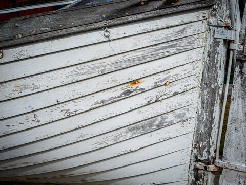 close up of old, weathered wooden boat hull