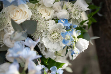 Obraz na płótnie Canvas Bridal bouquet. Wedding. Beautiful bouquet of white, blue flowers and greenery. Fresh flowers bouquet.