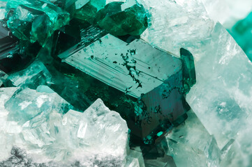 Dioptase crystal on white calcite. macro detail texture background. close-up raw rough unpolished...