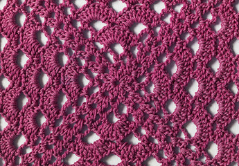 Crochet lilac granny square background. Handmade knitted openwork texture. Top view.