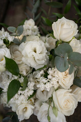 Wedding bouquet of white flowers - ranunculus, freesia, lisianthus.. Wedding. Bride and groom.