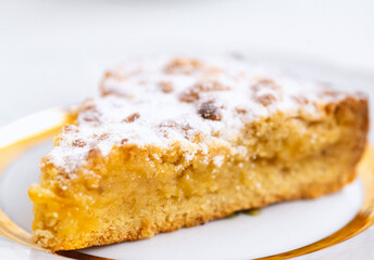 Piece of delicious homemade pie on a white plate