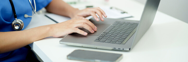 Doctor with tablet in medical office. Visiting Physician online concept