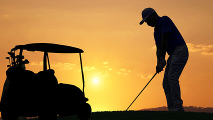 silhouette golfer playing golf with golf bag during beautiful sunset, concept healthy, copy space for put text  