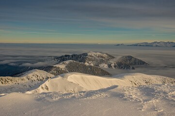 Beautiful panoramic view of mountains from low Tatras to Carpathian mountains, morning at sunrise with fog in valley, slovakia low tatras, dumbier, tatras