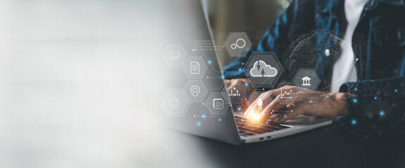 Businessman is using a laptop to access the cloud computing system , Storage and data transfer Cloud network , Cloud technology. Networking and internet service concept