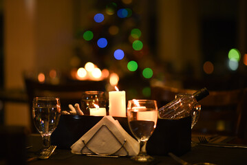 Candle lit table with lights bokeh 