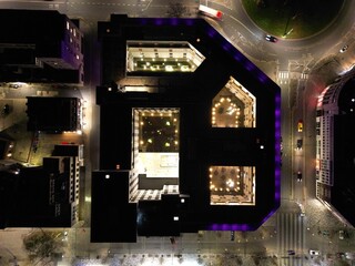 City at night, aerial drone photography lights of buildings and vehicles