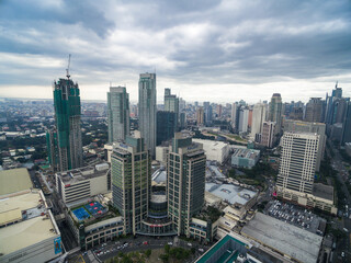 Naklejka na ściany i meble Manila Cityscape, Makati City with Business Buildings and Cloudy Sky. Philippines. Skyscrapers in Background.