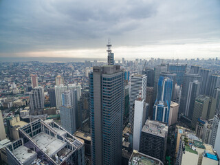 Manila Cityscape, Makati City with Business Buildings and Cloudy Sky. Philippines. Skyscrapers in Background.