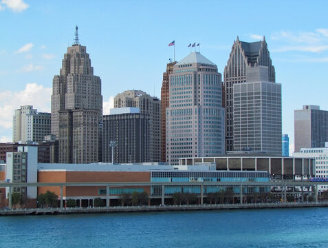 Detroit, USA - August 19, 2012: Detroit city downtown riverfront skyline viewed across Detroit river from Canada bank on sunny summer day. Blue sky Detroit cityscape