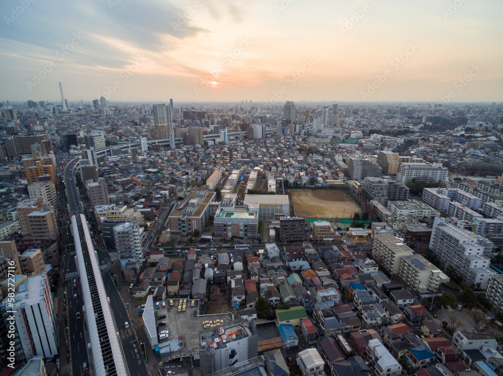 Sticker tokyo cityscape with local architecture and skyscraper in background. highway in background