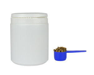 White plastic container and blue, measuring scoop with veterinary supplement isolated from background