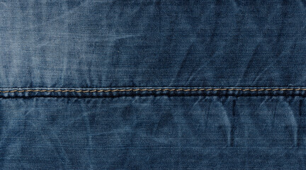 Naklejka premium Widescreen denim surface texture with stitching and folds