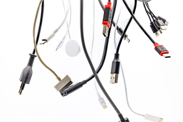 Chaos of plugs, adapters and cables for connecting small devices