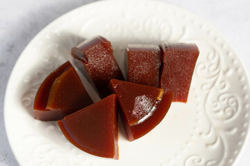 Guava sweet bars on a white plate.