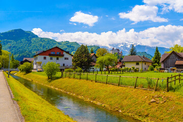 Fototapeta na wymiar River and houses near the mountains in Vaduz, Oberland Liechtenstein
